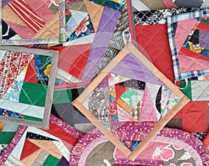 Colorful handmade textiles. Colored fabric patchwork background.