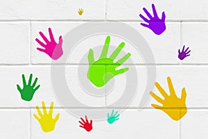 Colorful handprints on wall