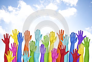 Colorful Hands Raised With Blue Sky