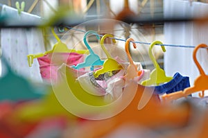 The colorful hangers are arranged in a neat and orderly manner