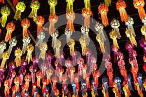 colorful hanging lanterns lighting on night sky in loy krathong festival