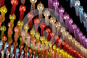 Colorful hanging lanterns lighting on night sky in loy krathong festival
