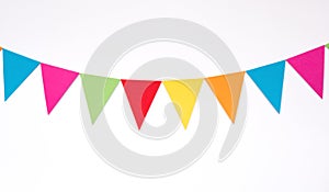 Colorful hanging paper flags on white wall background, decor items for party, festival, celebrate event