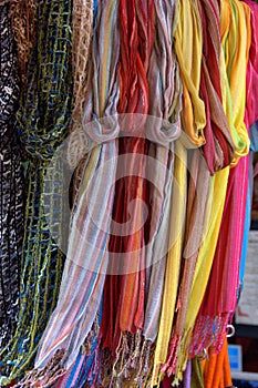 Colorful hanging scarfs photo