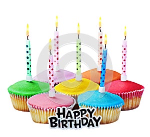 Colorful happy birthday cupcakes with candles