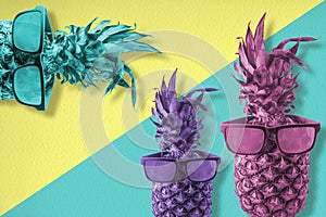 Colorful happy pineapple fruit wearing sunglasses