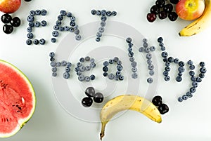Colorful healthy fruit and berries with text