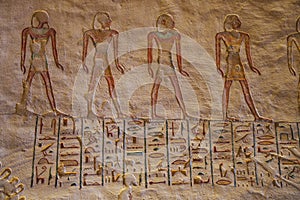 Colorful hieroglyphs in the tomb of Ramesses VII with painted figures