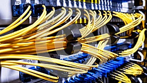 Colorful high speed optical fiber cables connected to the cloud network servers