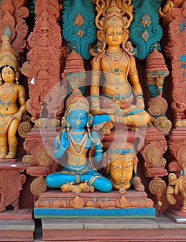 Colorful hindu statues on temple wall,generative ai