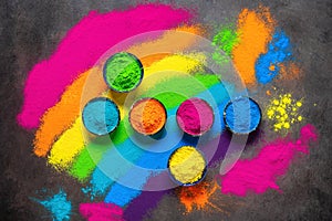 Colorful holi powders background. Holi colored paints in a bowl. Holi traditional festival. Top view