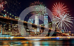 Colorful holiday fireworks panoramic view New York city Manhattan downtown skyline at night