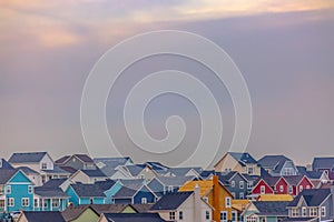 Colorful homes in Daybreak with sky in background