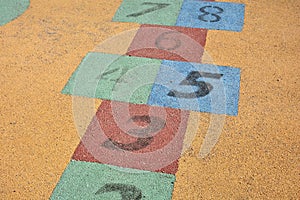 Colorful hopscotch made on the floor of a playground