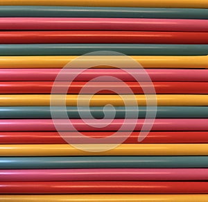 Colorful horizontal sticks as background.