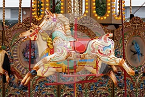 Colorful horses on a children carousel