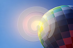 Colorful hot air balloon in flight against the blue sky