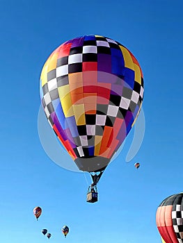 A Colorful Hot Air Balloon Floating above the Crowds