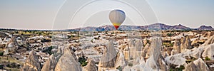 Colorful hot air balloon flying over Cappadocia, Turkey BANNER, LONG FORMAT