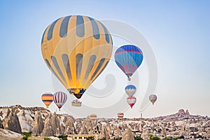 Colorful hot air balloon flying over Cappadocia, Turkey