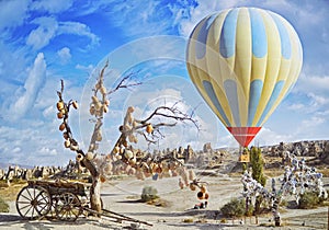 Colorful hot air balloon flying over the valley at Cappadocia photo