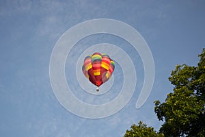 Colorful Hot Air Balloon flying overhead at Ashland Balloonfest