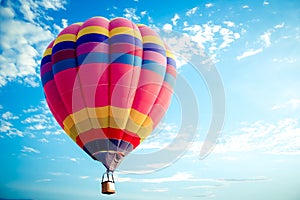Colorful hot air balloon flying on sky.