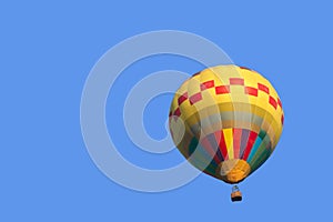 Colorful hot air balloon isolate on blue sky background