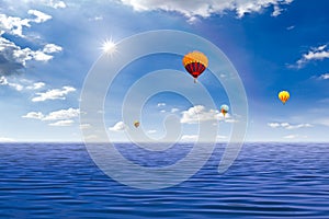 Colorful hot air balloon over the sea