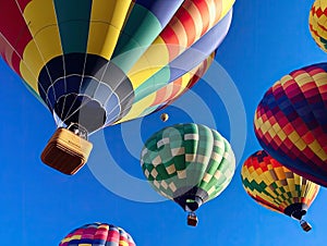 Colorful hot air balloons against blue sky