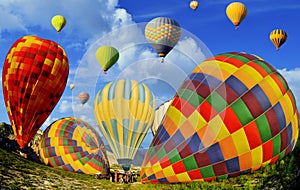 Colorful hot air balloons against blue sky