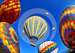 Colorful hot air balloons against blue sky