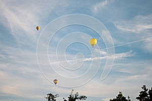 Colorful hot air balloons in blue sky