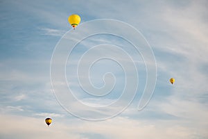 Colorful hot air balloons in blue sky