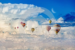 Colorful hot air balloons flying blue sea
