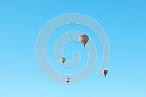 Colorful hot air balloons flying in blue sky