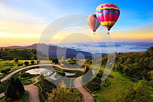 Colorful hot-air balloons flying over the mountain