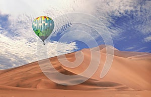 Colorful hot air balloons flying over sand dune seven, Walvis Bay, Namibia