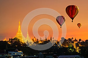 Colorful hot-air balloons flying over of Shwedagon Pagoda at Yangon, Myanmar