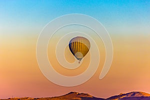 Colorful hot air balloons flying over the valley