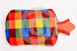 Colorful hot water bottle thermophore isolated on a whote background