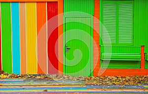 Colorful house. Bright colorful wall facade with green door and