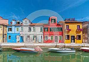 Colorful house and canal in Burano island, Venice, Italy