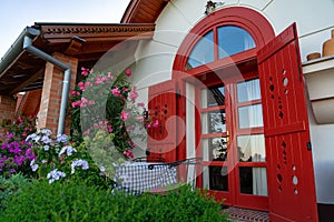 Colorful house entrance in Pecs Hungary with many flowers