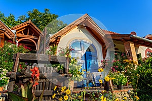 Colorful house entrance in Pecs Hungary with many flowers