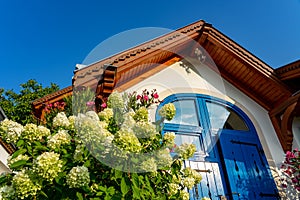 Colorful house entrance in Pecs Hungary with many flowers