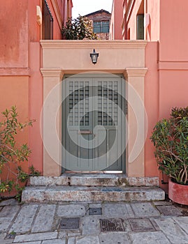 Colorful house grey door at Plaka picturesque neighborhood, Athens Greece