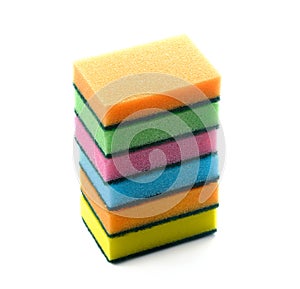 Colorful household sponges for washing dishes on a white background