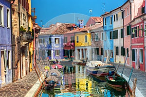 Colorful houses and canal on Burano island, near Venice, Italy.