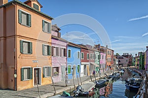 Colorful houses and canal on Burano island, near Venice, Italy.